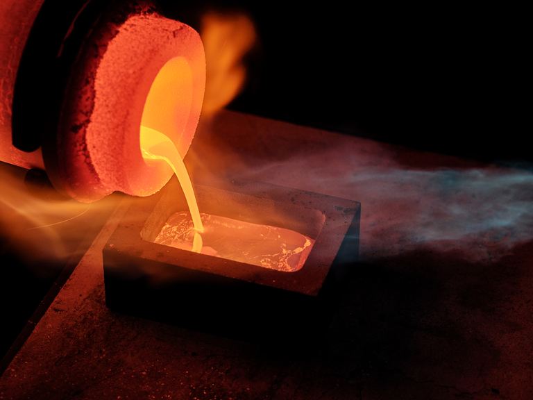 Molten gold being poured from a crucible into an ingot mould at Hobart Mint